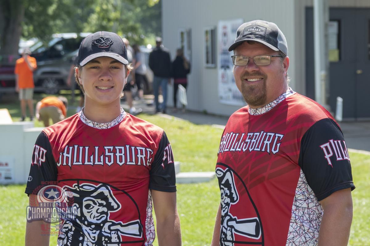 Two teammates smile for the camera during the USA Clay Target League national championships.