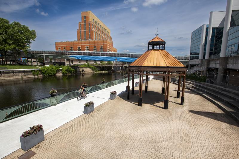 Bike rider on the Lansing River Trail in Downtown Lansing
